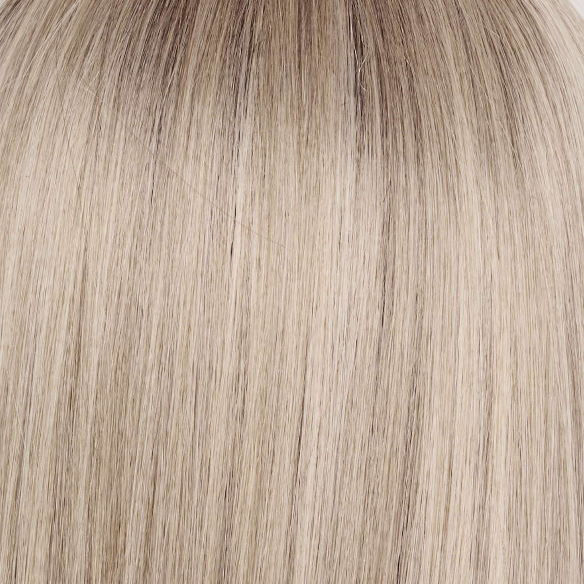 Billionaire Blond   -  A sophisticated hue featuring a rich mocha chocolate root that transitions into finely woven beige, ash, and cream blond tones. The face-framing luxurious cream and white blond highlights elevate the color